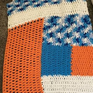 Fluffy orange, blue and white blanket. Homemade